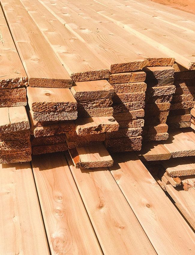 a pile of lumber in a lumber yard in Vermont